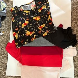 A collection of Lularoe Irma tops great solids and a Disney Winnie the Pooh!